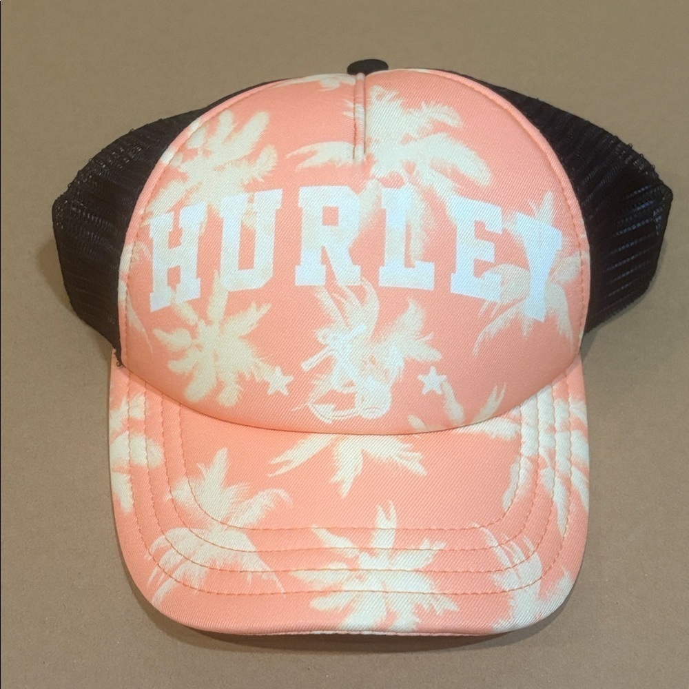 Hurley adjustable snap-back trucker hat in peach with white and black accents